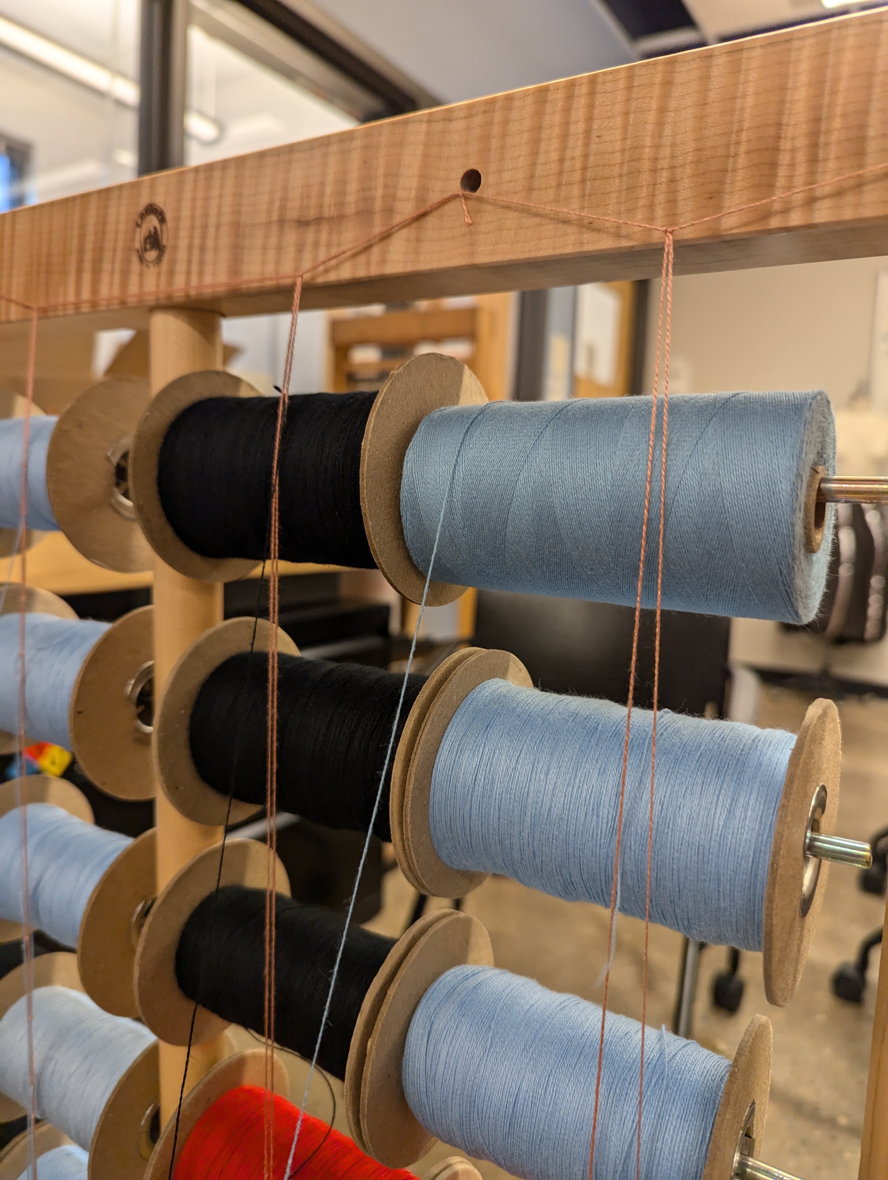 warping spools on a rack
